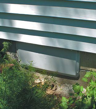 A gray crawl space vent cover in Hinton