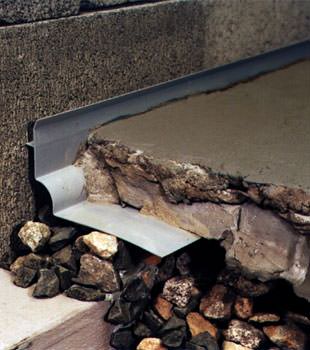 a custom designed basement drain system for thin basement floors in Beaumont.