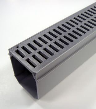 A closeup of our grated basement drainage pipe system, installed in Westlock