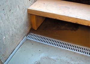 a hatchway entrance in Whitecourt that has been protected from flooding by our TrenchDrain basement drainage system.