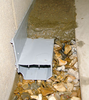 A basement drain system installed in a Leduc home